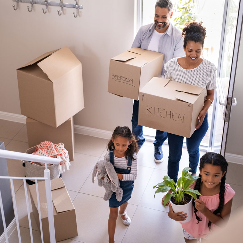 family moving boxes in a new home